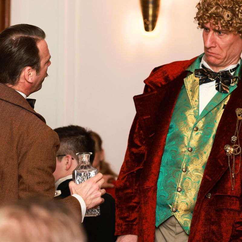 Arthur Conan Doyle und Sir John im Streitgespräch